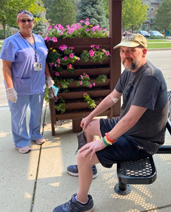 Patient with nurse outside